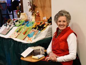 A volunteer at the bazaar