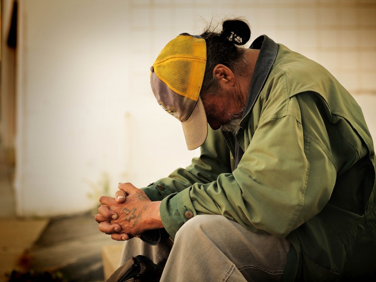 Image of a man bowed in prayer