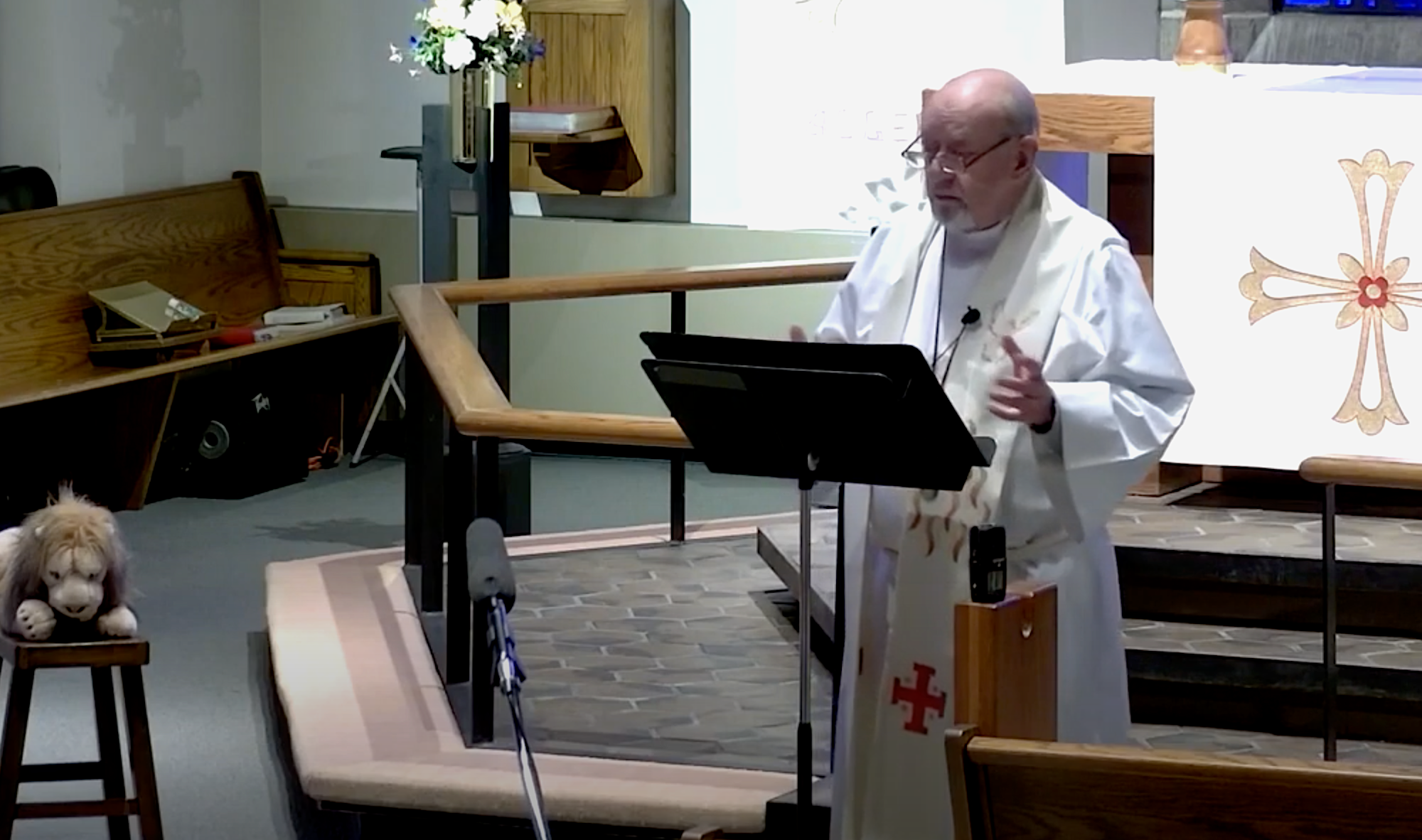 Interim Pastor David Mueller in the sanctuary