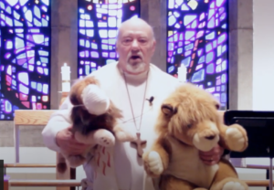 Interim Pastor David E. Mueller with Lenny and Leroy the lions