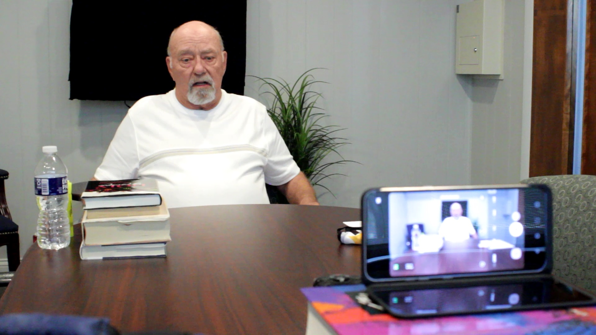 Camera lens view of Interim Pastor David Mueller