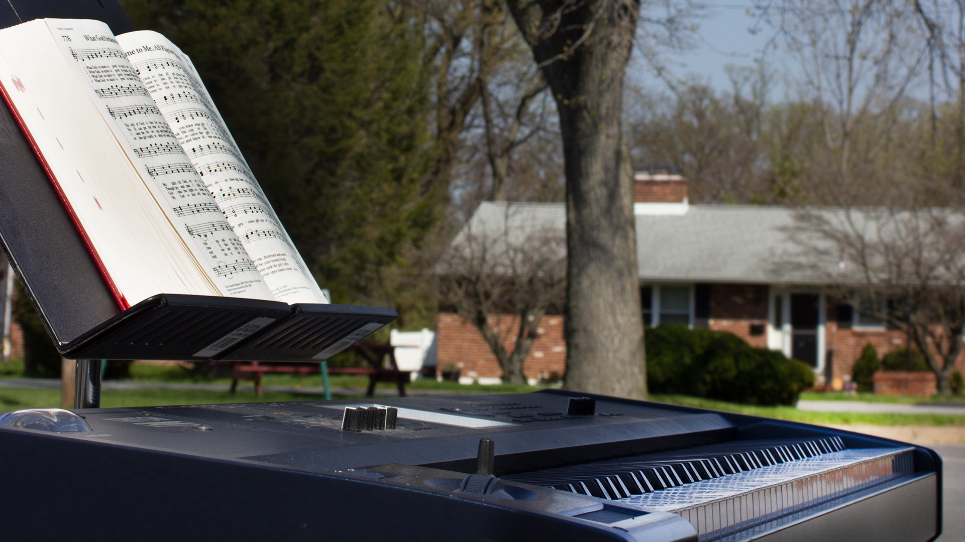 John Lasher's portable keyboard and a hymn book. Photo by John Lasher