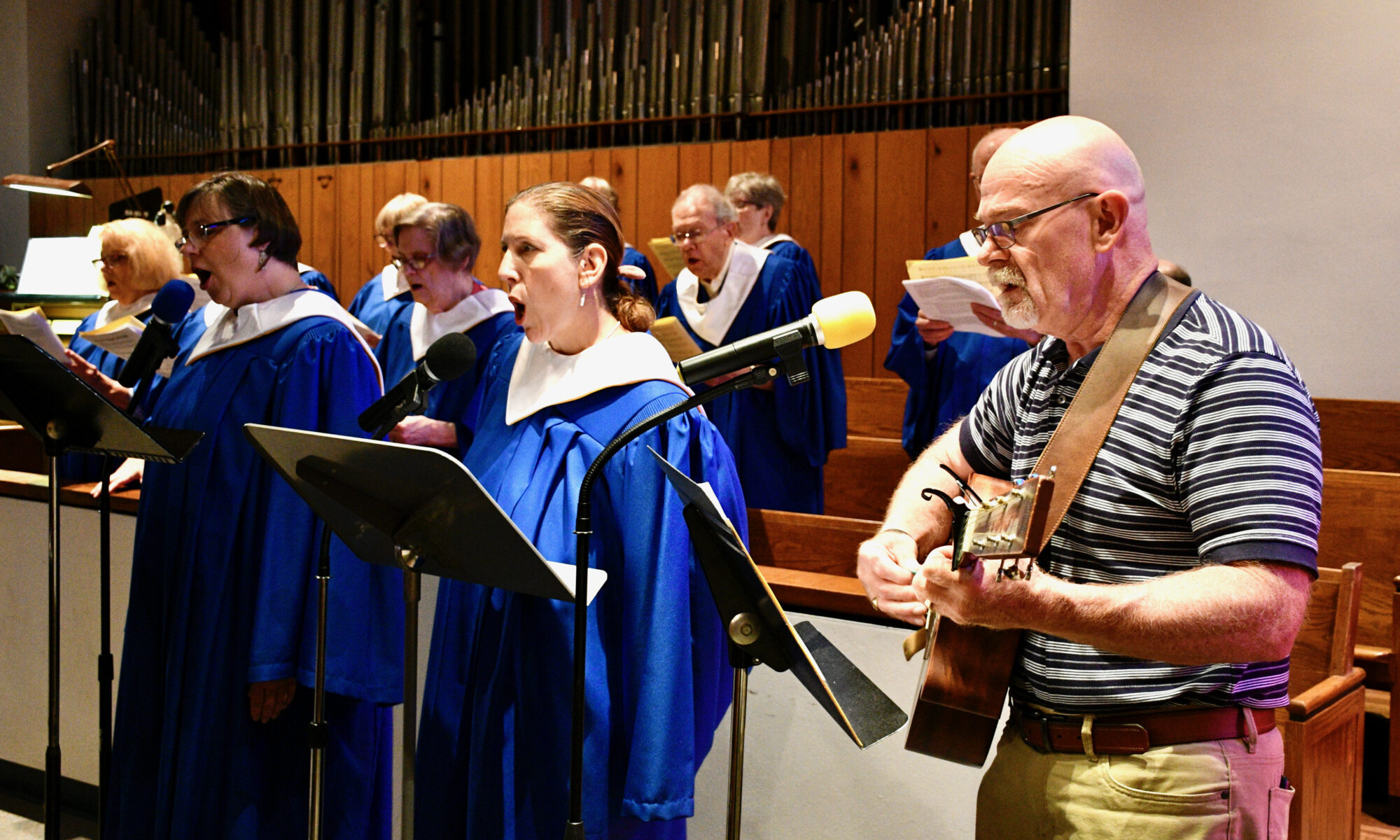 Choir and praise band musicians leading worship in the sanctuary