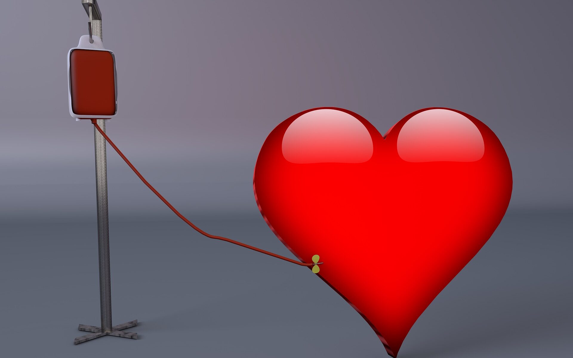 A heart connected to an IV bag.